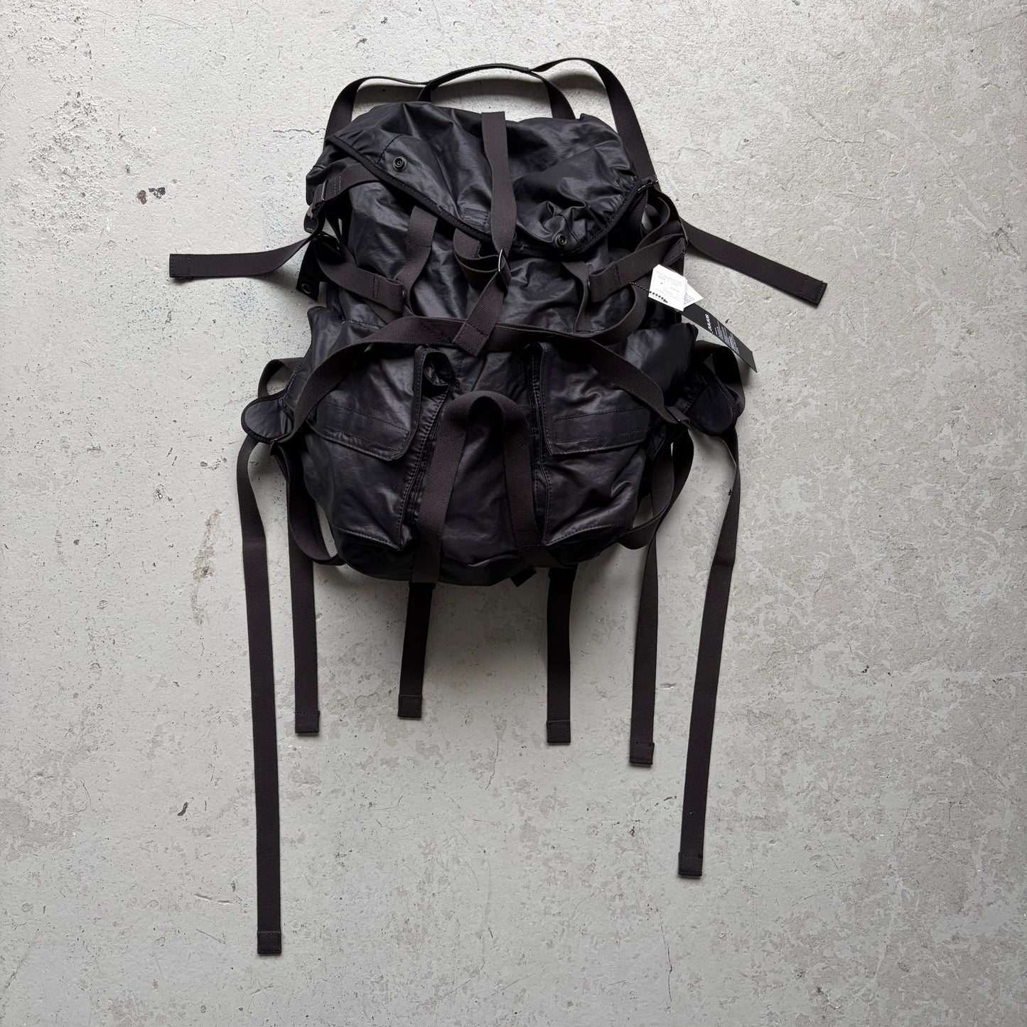 Julius SS24 Black Coated Memory Cloth Utility Backpack (OS)