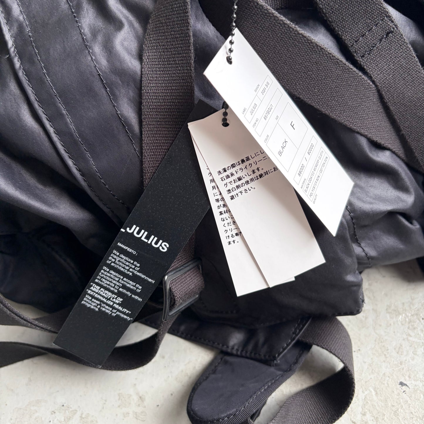 Julius SS24 Black Coated Memory Cloth Utility Backpack (OS)