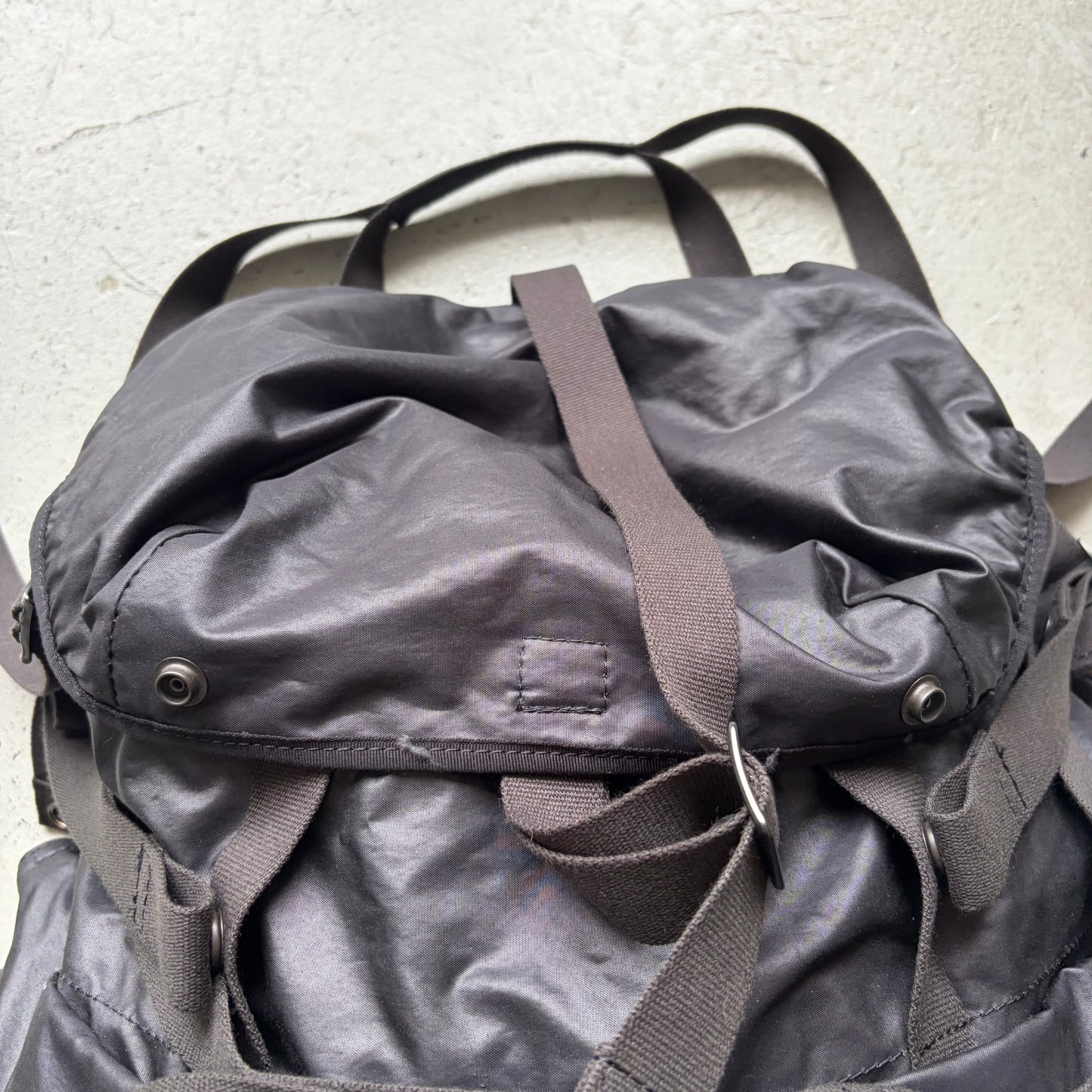 Julius SS24 Black Coated Memory Cloth Utility Backpack (OS)