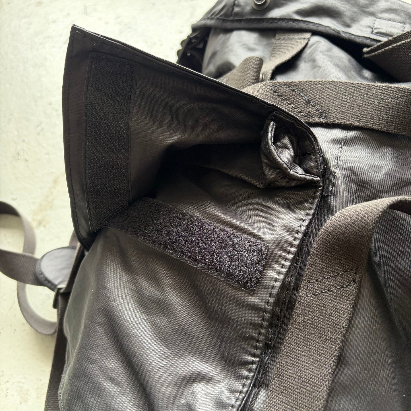 Julius SS24 Black Coated Memory Cloth Utility Backpack (OS)