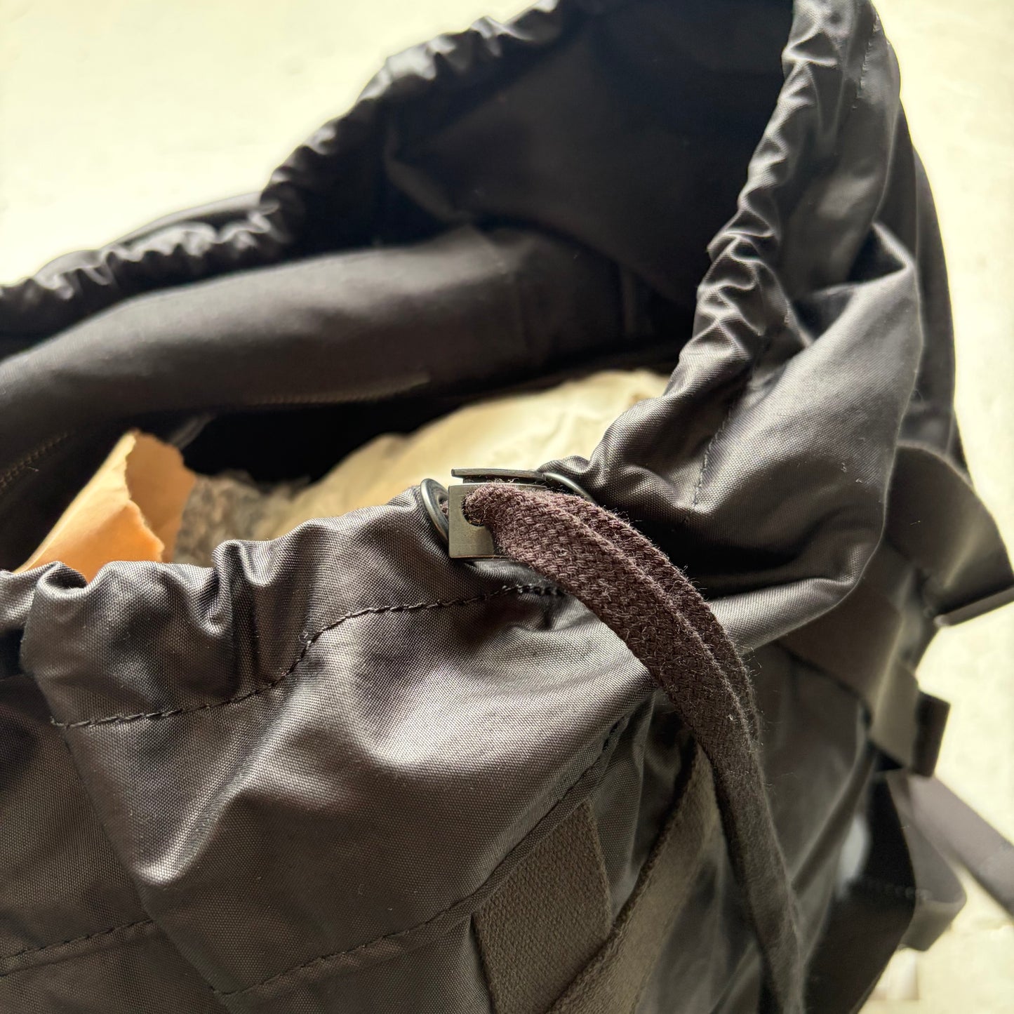 Julius SS24 Black Coated Memory Cloth Utility Backpack (OS)